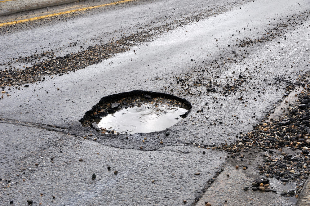 You are currently viewing KASAMA RESIDENTS WANT PERMANENT SOLUTION ON AIRPORT ROAD POTHOLES